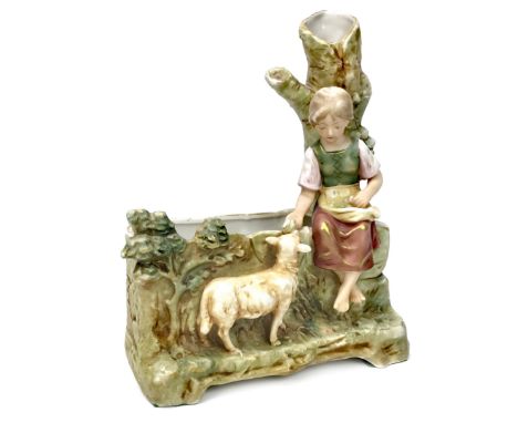 ROYAL DUX FIGURAL PLANTER, modelled as a young girl feeding a lamb, on a naturalistic base, applied triangle to base, 25cm hi