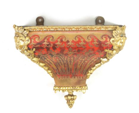 A 19TH CENTURY BOULLE TORTOISESHELL BRACKET CLOCK WALL MOUNT of shaped form with ormolu mounts18cm high 14cm wide 11cm deepIn