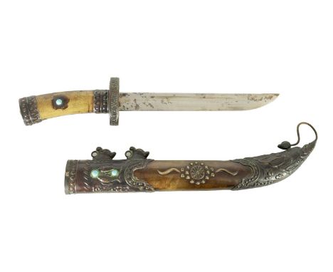 A 19TH CENTURY MONGOLIAN DAGGER the 22cm single-edged fullered steel blade with embossed geometric oval hilt above an engrave