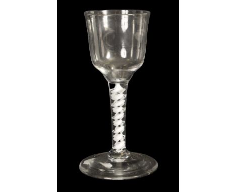 AN 18TH CENTURY LARGE WINE GLASS the ogee bowl on a spiral thread and double tape opaque twist stem with broad slightly domed