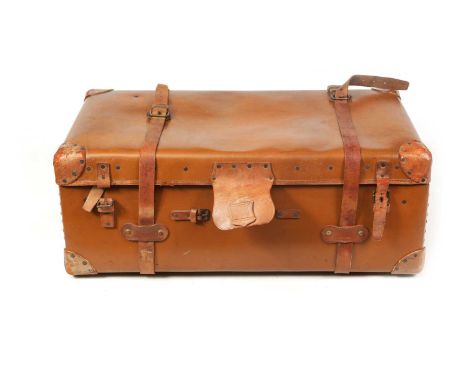 A LARGE EARLY 20TH CENTURY LEATHER TRUNK having leather straps and brass lock92cm wide, 36cm high, 52cm deep