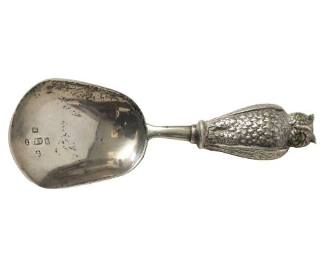 A GEORGIAN SILVER CADDY SPOON with finely engraved owl handle set with green gemstone eyes, Birmingham 1840