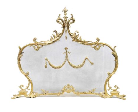 A LATE 19TH CENTURY CAST BRASS FIRE SCREEN in the French Rococo style with meshwork front and centre double swag.99cm wide 80