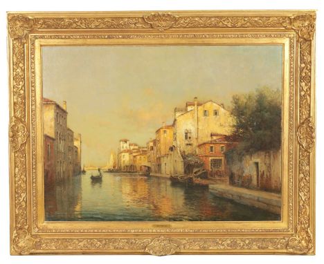 ANTOINE BOUVARD SNR. (1870-1956). AN EARLY 20TH CENTURY OIL ON CANVAS VENETIAN CANAL SCENE - signed, in gilt swept frame.59cm