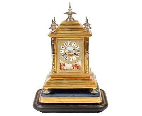 A 19TH CENTURY PORCELAIN PANELLED FRENCH SILVERED AND GILT BRASS MANTEL CLOCK the case with stepped pediment fitted turned si