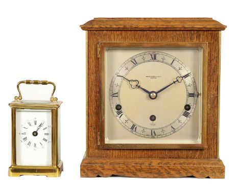 A MID 20TH CENTURY ELLIOTT QUARTER CHIMING MANTEL CLOCK the oak case with brass corners enclosing a 5.5" silvered dial with R