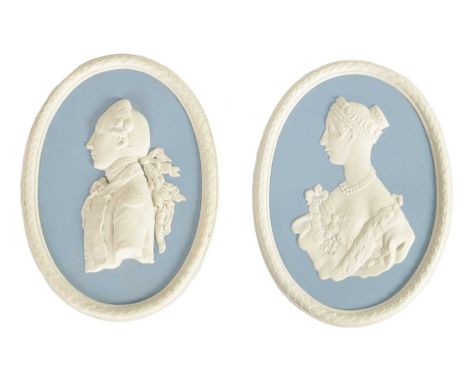 A PAIR OF 20TH CENTURY WEDGWOOD PORTRAIT WALL PLAQUES of cameo style with acanthus leaf borders and impressed marks on revers