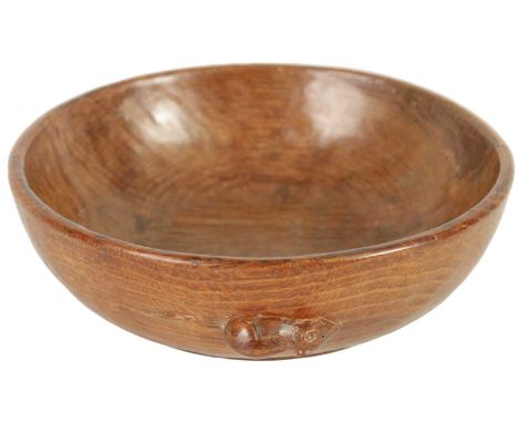 A ROBERT ‘MOUSEMAN’ THOMPSON ADZED DARK OAK FRUIT BOWL of deep circular form with carved mouse motif to the outer edge.24.5cm