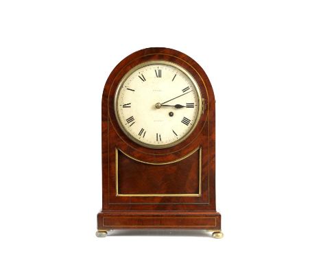 RUSSELL, LONDON. A REGENCY BRASS INLAID FIGURED MAHOGANY BRACKET CLOCK the arched case with brass string inlay and sunken bra