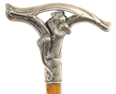 A FINE LATE 19TH CENTURY ART NOUVEAU STYLE RHINOCEROS HORN SILVER MOUNTED WALKING CANE with solid silver handle modelled as a