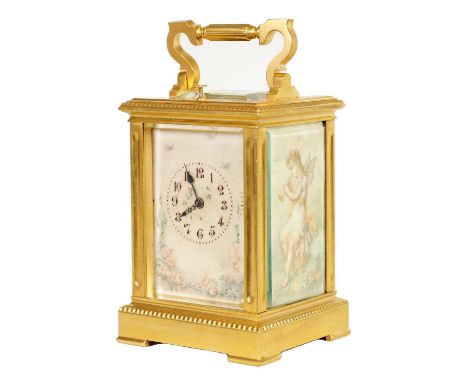 A LATE 19TH CENTURY FRENCH GILT BRASS AND IVORY PANELLED REPEATING CARRIAGE CLOCK the case enclosing glazed ivory panels depi