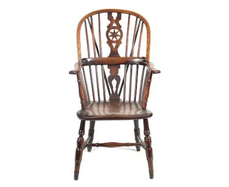 AN EARLY 19TH CENTURY YEW-WOOD AND ELM HIGH BACK WINDSOR CHAIR the stick back with shaped fret cut and starwork tapering cent