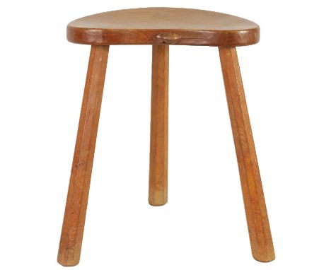 A ROBERT ‘MOUSEMAN’ THOMPSON LIGHTLY ADZED OAK MILKING STOOL the dished heart-shaped seat with carved mouse to the front edge