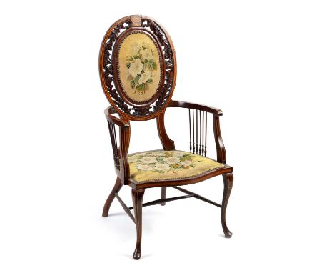 AN EDWARDIAN INLAID ROSEWOOD ARMCHAIR WITH TAPESTRY UPHOLSTERY the raised oval back with leaf carved border and open arms sup