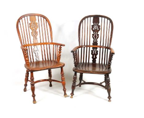 TWO 19TH CENTURY YEW-WOOD HIGH BACK WINDSOR CHAIRS with shaped pierced centre splats and turned upright arm supports; elm sad