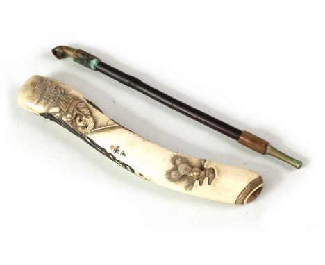 A MEIJI PERIOD JAPANESE CARVED ANTLER PIPE CASE decorated with a fisherman and his catch, inscribed signiature aboveCase 19cm