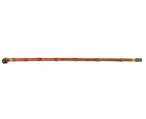 A 19TH CENTURY CARVED BULL DOG HEAD WALKING STICK opened mouthed with amber glass eyes and brass collar on bamboo cane88.5cm 