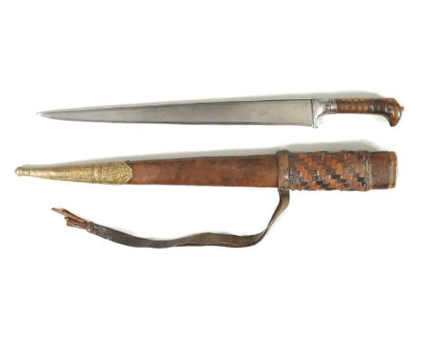 A 19TH CENTURY INDIAN KHYBER KNIFE with a broad tapering single edged steel blade, flattened spine and carved beak-shaped rhi