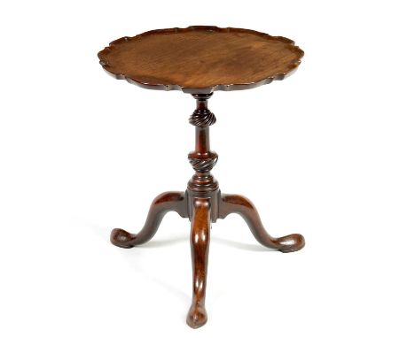 AN 18TH CENTURY MAHOGANY TRIPOD TABLE in the Chippendale style with pie crust moulded top, on a twisted ring turned vase shap