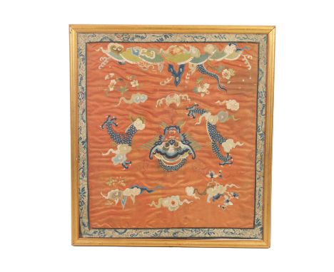 A 19TH CENTURY CHINESE SILK TAPESTRY DEPICTING A DRAGON amongst clouds - glazed gilt frame.65cm high 58cm wide 