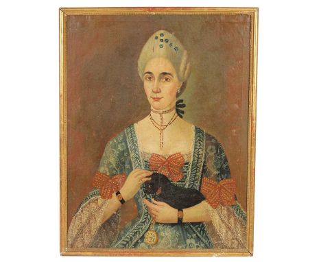 17TH CENTURY CONTINENTAL SCHOOL OIL ON CANVAS Half length portrait of an aristocratic lady holding a lap dog. Narrow moulded 
