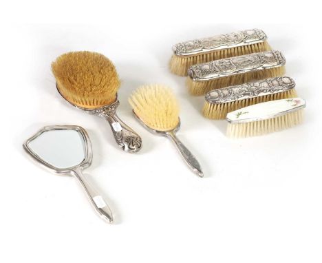 A STYLISH EDWARD VII SILVER FOUR PIECE DRESSING TABLE SET OF STRONG ART NOUVEAU DESIGN comprising of four brushes, the silver