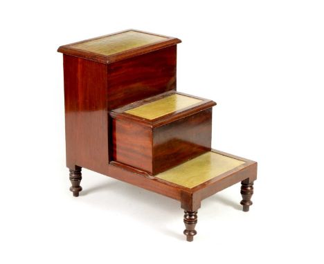 A SET OF LATE GEORGIAN MAHOGANY LIBRARY STEPS with gilt tooled green leather hinged tops; raised on short turned legs46cm wid