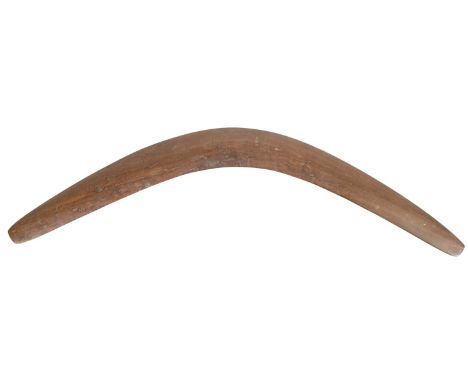 AN UNUSUALLY LARGE 19TH CENTURY ABORIGINAL BOOMERANG in figured hardwood with a slightly bowed surface81cm wide