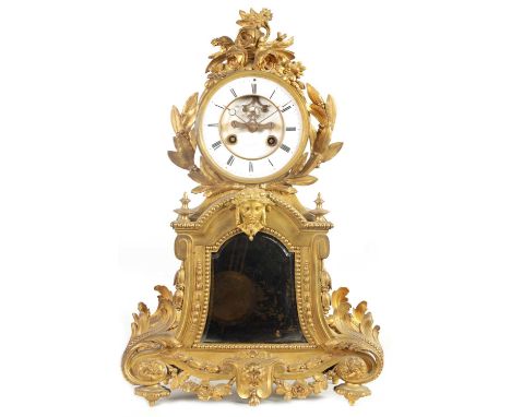 A 19TH CENTURY FRENCH ORMOLU LARGE MANTEL CLOCK the ornate case with leaf and flower head crested drum shaped top above a ski