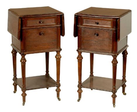 A PAIR OF 19TH CENTURY FRENCH ROSEWOOD BEDSIDE CABINETS with hinged fold-down tops, frieze drawers and cupboard bases; raised