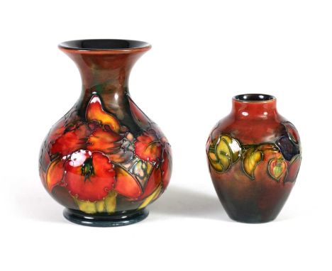 TWO MOORCROFT FLAMBÉ WARE CABINET VASES the 1930's small shouldered tapering Vase tube lined and decorated with a band of cle