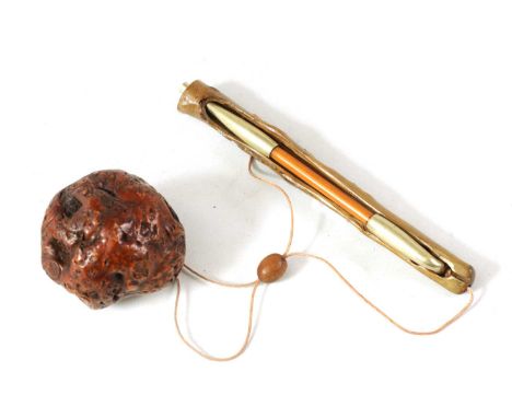 A MEIJI PERIOD JAPANESE PIPE, PIPE CASE AND TOBACCO POUCH the signed stained wood case with nickel mounted pipe and burr pouc