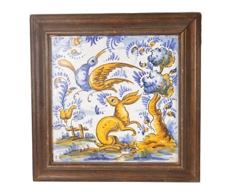 A 19TH CENTURY PORTUGUESE CERAMIC TILE polychrome coloured depicting a rabbit and bird in a landscape setting - in later moul