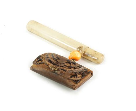 A JAPANESE MEIJI PERIOD ANTLER PIPE CASE, IVORY OJIME AND TOBACCO POUCH the case of plain form with an ivory ojime realistica