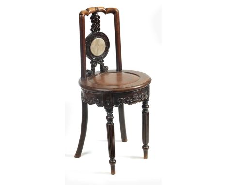 AN UNUSUAL 19TH CENTURY ANGLO CHINESE HARDWOOD SIDE CHAIR the circular panelled seat with scroll and rosette carved shaped ap