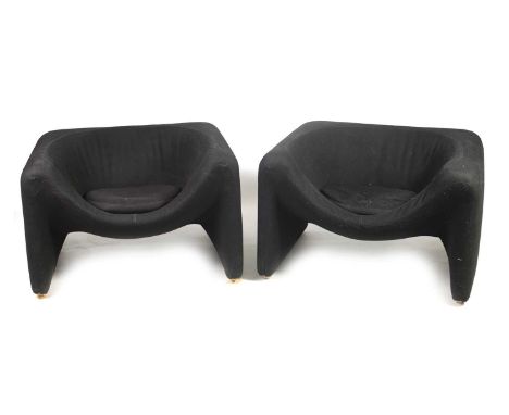A PAIR OF MID 20TH CENTURY VINTAGE BLACK UPHOLSTERED CHAIRS with dished seats and raised on wooden shoes.86cm wide 73cm deep 