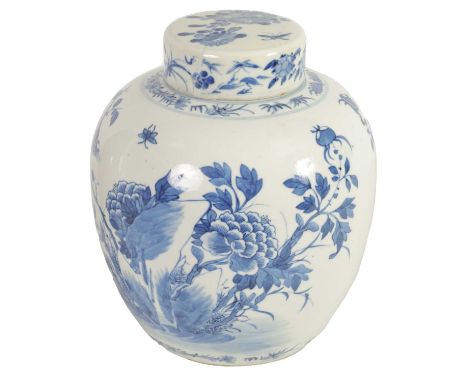 AN 18TH CENTURY CHINESE BLUE AND WHITE GINGER JAR AND COVER decorated with flowering branchwork - signed with four character 