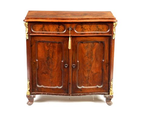 A 19TH CENTURY FRENCH MAHOGANY AND GILT CARVED SERPENTINE SHAPED SIDE CABINET with freize drawer and hinged panelled doors; r