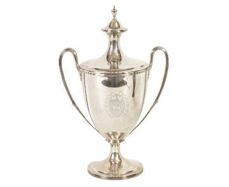 A FINE GEORGE III SILVER TROPHY CUP AND COVER OF LARGE SIZE the urn-shaped body on a ribbed pedestal foot with leaf cast side