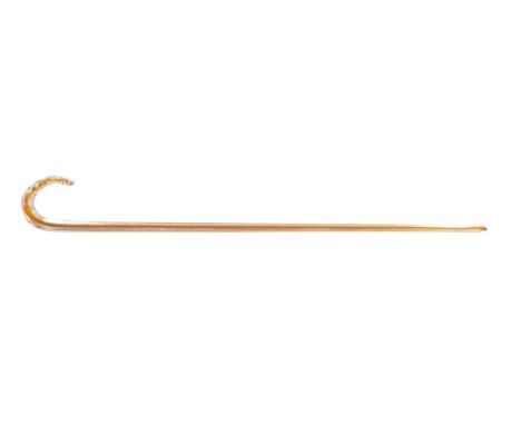 A LATE 19TH CENTURY GLASS WALKING STICK of triangular form with amber cane centre and twisted handle.78.5cm overall