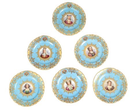 A SET OF SIX SEVRES STYLE PORCELAIN CABINET PLATES with finely painted portrait centres surrounded by a blue ground with gilt