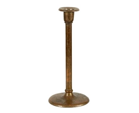 A ROYCROFT SHEFFIELD ARTS AND CRAFTS PLANISHED PATINATED COPPER CANDLESTICK with circular base and plain ringed stem - marker