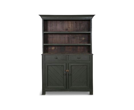 A GREEN PAINTED PINE DRESSER,the moulded cornice above two open shelves and plain slated back, the conforming base with two f