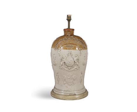 A VICTORIAN GLAZED EARTHENWARE FLAGON,with cast decoration and inscribed 'O'Connor Brothers, Sligo 1875', with spiral twist h