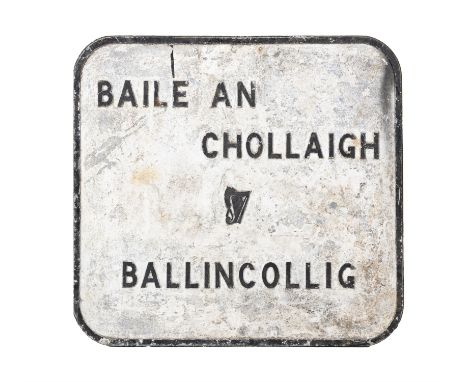 AN IRISH BLACK AND WHITE PAINTED SIGN,of shaped rectangular form with a raised boarder, central harp motif and lettering 'BAI