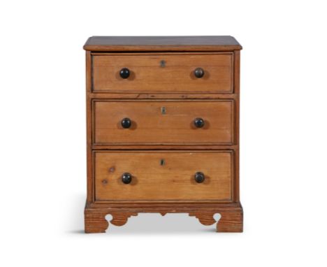 A STAINED PINE APPRENTICE CABINET MAKER’S MINIATURE CHEST OF DRAWERS, 19TH CENTURY,the moulded top above three long graduated