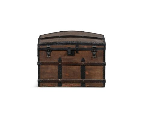 A TIMBER CANVAS AND METAL BOUND TRUNK, BY J FAGAN & CO., 19 ASTON QUAY, DUBLIN, EARLY 20TH CENTURY, the domed top with  lift 