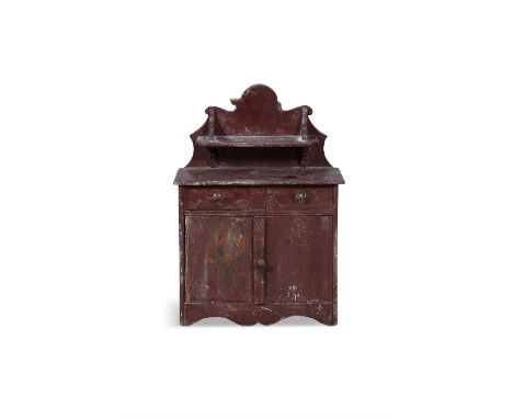 A 19TH CENTURY RED PAINTED TIMBER SCALE MODEL OF AN IRISH CUPBOARD,the wavy gallery back with shaped rectangular shelf and sh