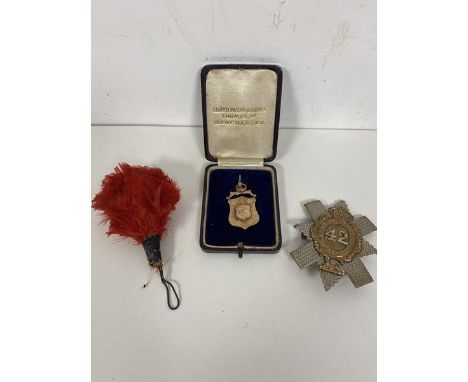 A 9ct gold medal inscribed verso Presented to Lance Corporal Wyatt First Blackwatch Regiment by R Gardiner Laxeyglen Gardens 