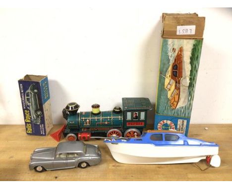 A mid 20thc Japanese Western style train engine stamped modern toys measures 14cm x 34cm x 12cm along with Scalex boat Derwen